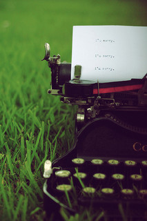 Typewriter on green lawn