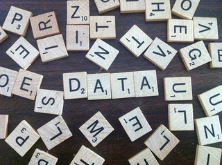 Scrabble letters spelling DATA amongst a jumble.