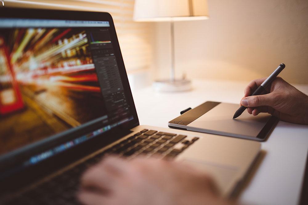 A designer working on a laptop